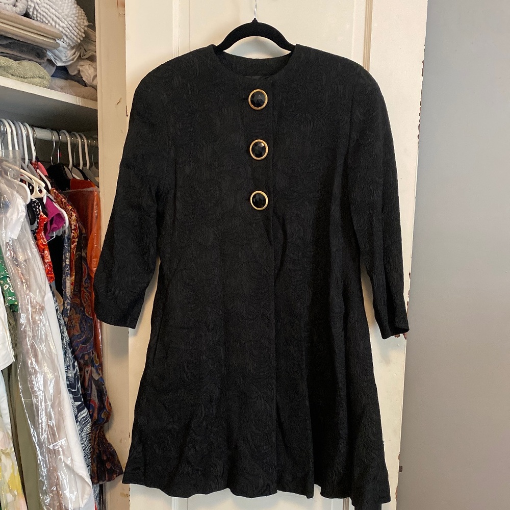 Jacket gold and black buttons with floral imprint, recorder sleeves byJaeger